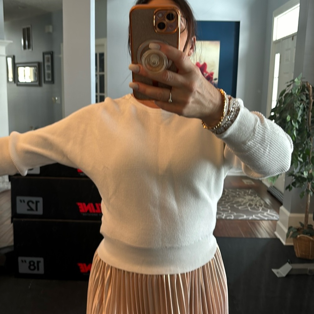 White sweater from Express. Has gold detail on shoulders.